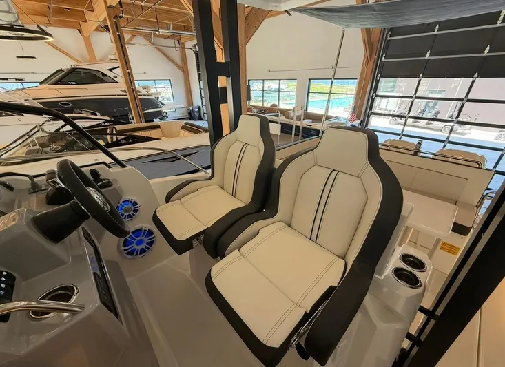  Yacht Photos Pics 2025 Jeanneau Leader 9.0 WA interior with modern helm and comfortable seating.