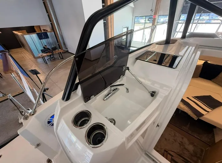  Yacht Photos Pics 2025 Jeanneau Leader 9.0 WA boat interior with sink and seating area.