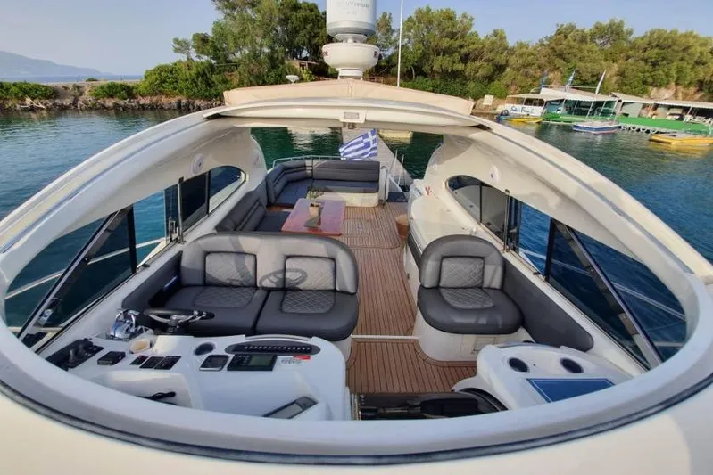  Yacht Photos Pics Luxurious 2000 Sunseeker Predator 56 yacht interior with elegant seating and control panel.