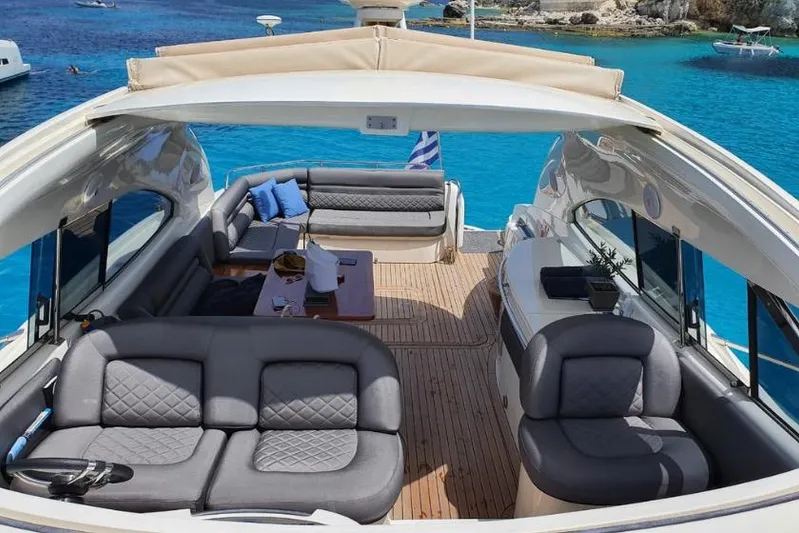  Yacht Photos Pics Luxurious Sunseeker Predator 56 yacht interior, 2000 model, with elegant seating and stunning ocean view.