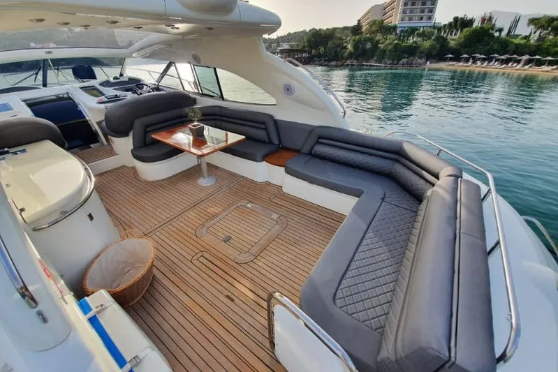  Yacht Photos Pics Luxurious Sunseeker Predator 56 yacht interior, 2000 model, featuring elegant seating and wooden deck.