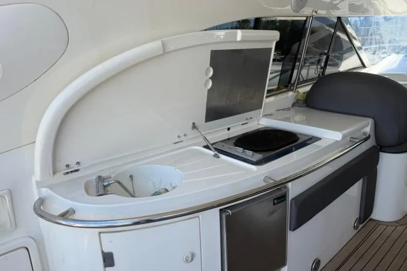  Yacht Photos Pics Outdoor kitchen on a 2000 Sunseeker Predator 56 yacht with grill and sink.