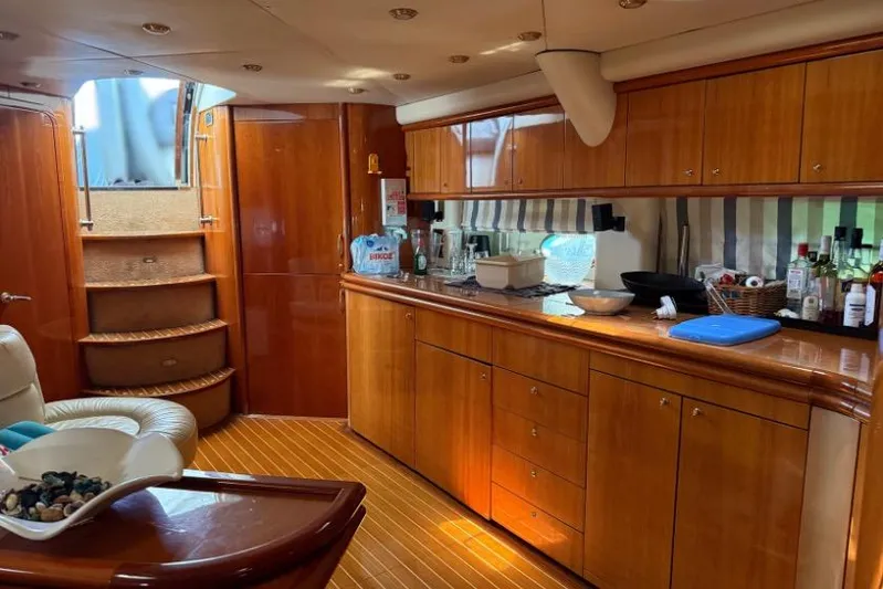  Yacht Photos Pics Luxurious interior of 2000 Sunseeker Predator 56 yacht with wooden cabinetry and modern amenities.