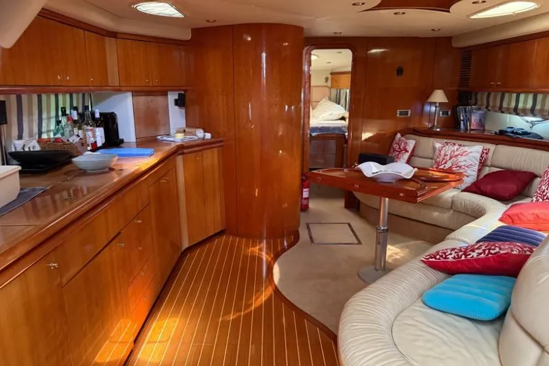  Yacht Photos Pics Luxurious interior of a 2000 Sunseeker Predator 56 yacht with elegant wood finishes.