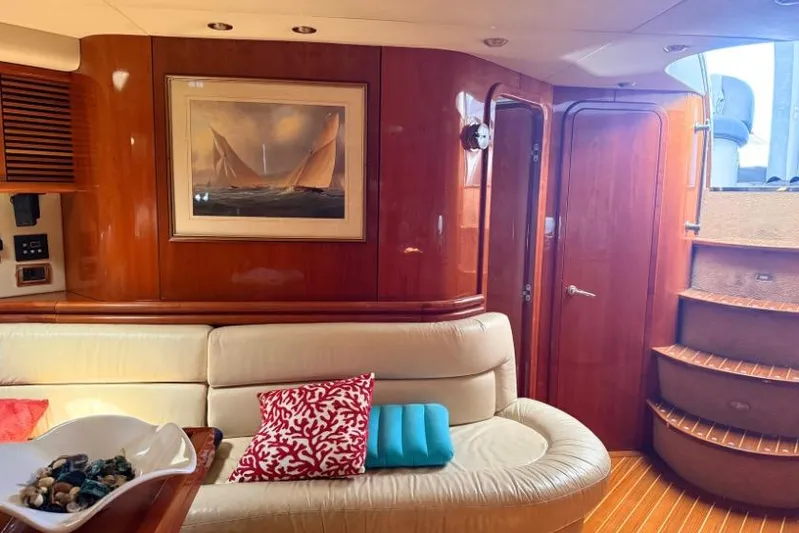  Yacht Photos Pics Luxurious Sunseeker Predator 56 yacht interior with elegant wood finish and comfortable seating.