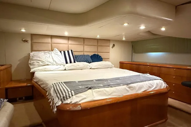  Yacht Photos Pics Luxurious bedroom interior of 2000 Sunseeker Predator 56 yacht with elegant bedding.