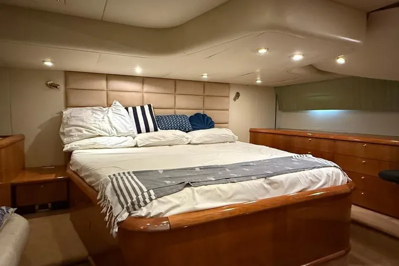  Yacht Photos Pics Luxurious bedroom interior of 2000 Sunseeker Predator 56 yacht with elegant bedding.