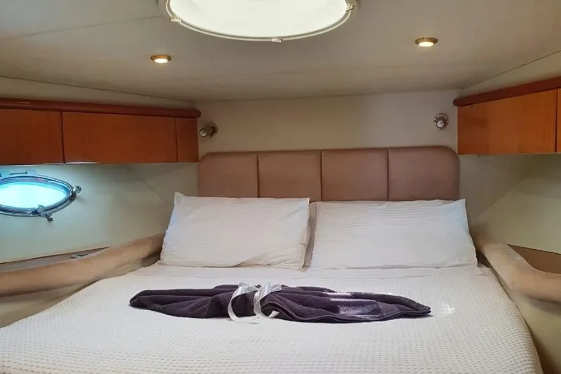  Yacht Photos Pics Luxurious cabin interior of 2000 Sunseeker Predator 56 yacht with cozy bedding.