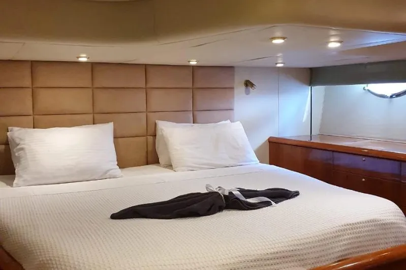  Yacht Photos Pics Luxurious cabin interior of 2000 Sunseeker Predator 56 yacht with cozy bedding.