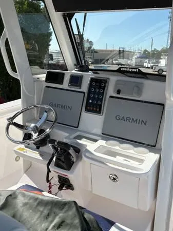  Yacht Photos Pics 2012 Everglades 325 Center Console boat cockpit with Garmin navigation displays.