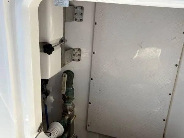  Yacht Photos Pics Interior compartment of 2012 Everglades 325 Center Console boat, showing mechanical components.