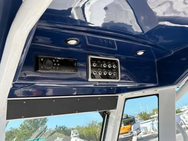  Yacht Photos Pics 2012 Everglades 325 Center Console boat dashboard with audio system and controls.