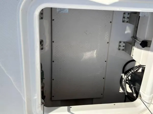  Yacht Photos Pics Storage compartment of 2012 Everglades 325 Center Console boat, showing interior details.