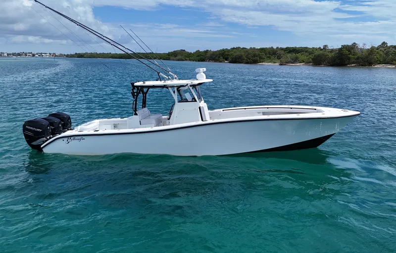  Yacht Photos Pics 2017 Yellowfin 36 Offshore boat on clear blue water, equipped with Mercury engines.