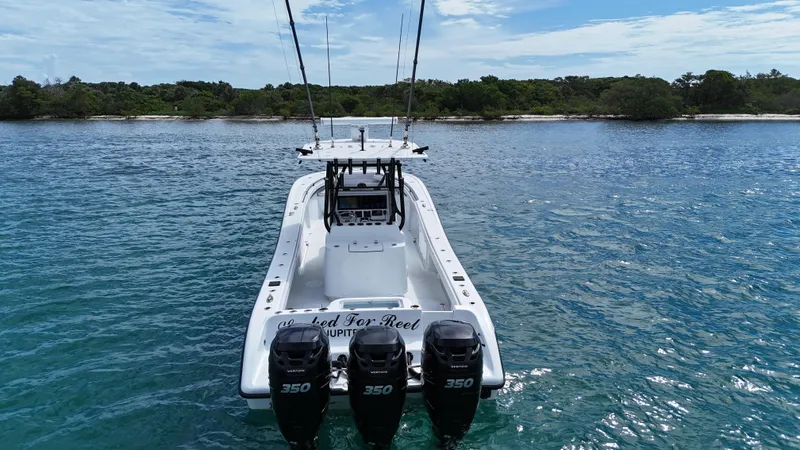  Yacht Photos Pics 2017 Yellowfin 36 Offshore boat with triple 350 engines on calm water.