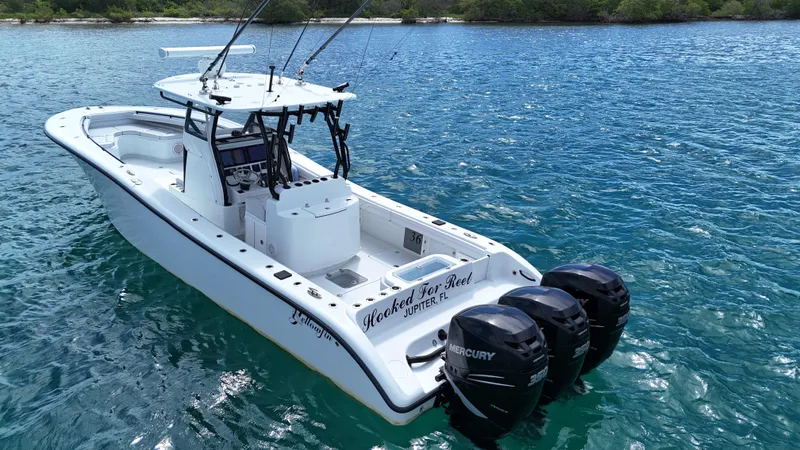  Yacht Photos Pics 2017 Yellowfin 36 Offshore boat with triple Mercury engines on blue water.
