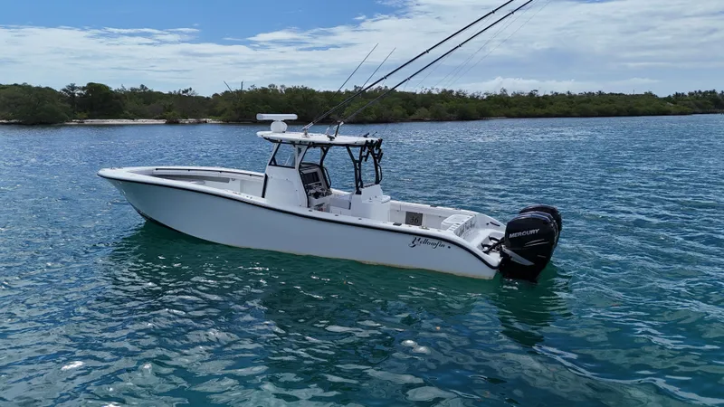  Yacht Photos Pics 2017 Yellowfin 36 Offshore boat on calm blue water, equipped with Mercury engines.