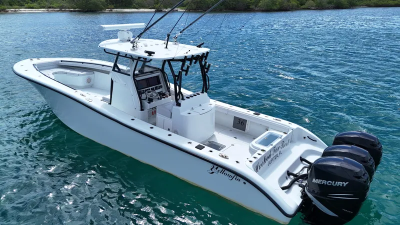  Yacht Photos Pics 2017 Yellowfin 36 Offshore boat with triple Mercury engines on blue water.