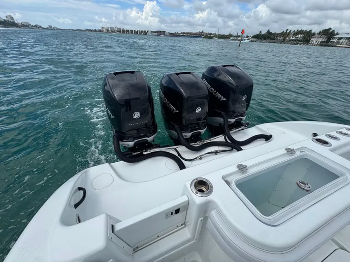  Yacht Photos Pics 2017 Yellowfin 36 Offshore boat with triple Mercury outboard engines on open water.
