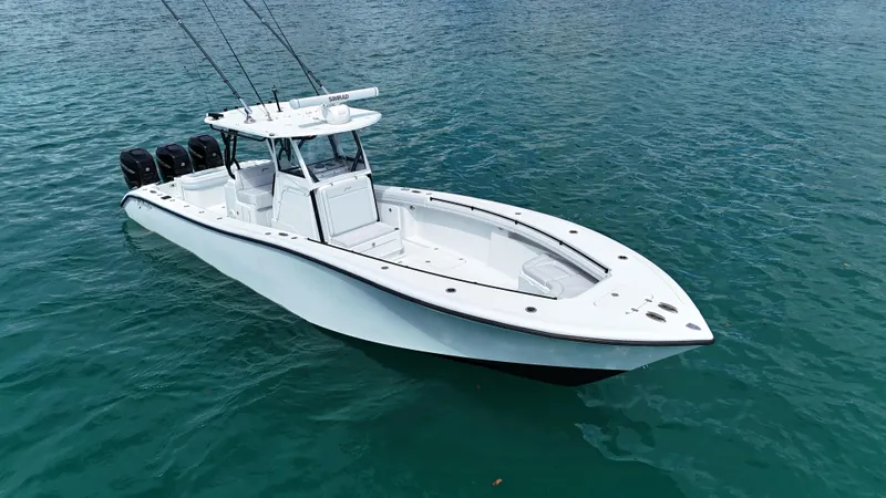  Yacht Photos Pics 2017 Yellowfin 36 Offshore boat on clear blue water, equipped with multiple outboard engines.