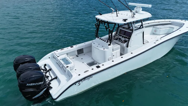  Yacht Photos Pics 2017 Yellowfin 36 Offshore boat with triple Mercury engines on blue water.