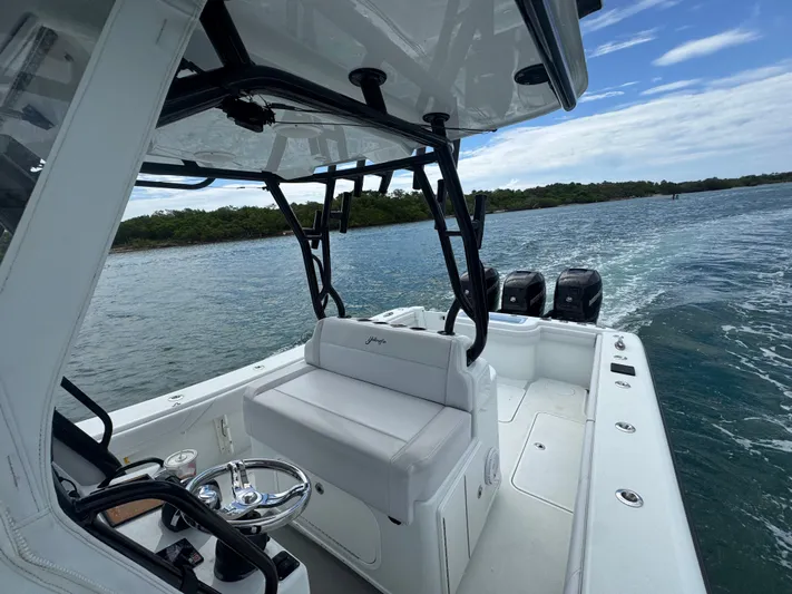  Yacht Photos Pics 2017 Yellowfin 36 Offshore boat cruising on open water, featuring sleek design and powerful engines.