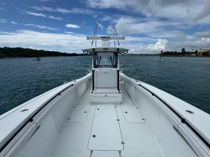  Yacht Photos Pics 2017 Yellowfin 36 Offshore boat on open water under cloudy sky.