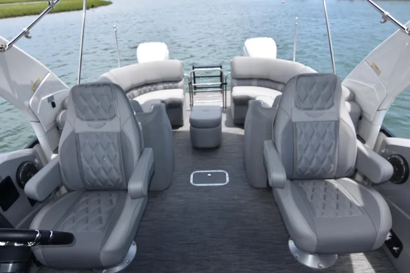  Yacht Photos Pics 2024 Bennington 27 QFB boat interior with luxurious gray seating and spacious layout.