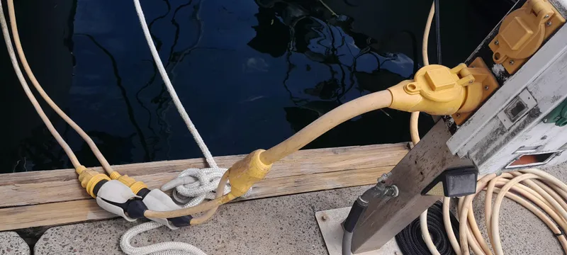 Picaro Yacht Photos Pics Power cables connected to a dock for a 2005 Beneteau Oceanis 473 sailboat.