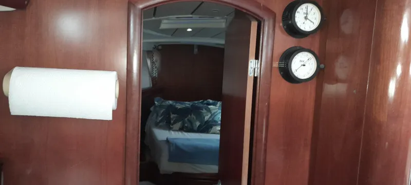 Picaro Yacht Photos Pics Interior of 2005 Beneteau Oceanis 473 yacht with wood paneling and cozy cabin view.