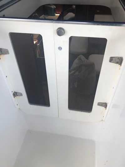 Picaro Yacht Photos Pics Beneteau Oceanis 473 cabin entrance, 2005 model, featuring dual glass-paneled doors.