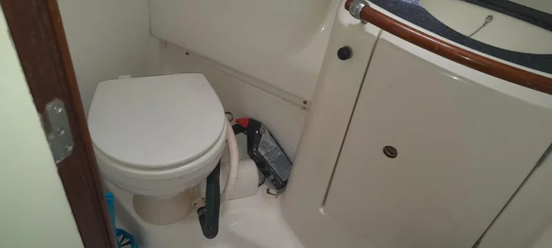 Picaro Yacht Photos Pics Bathroom interior of 2005 Beneteau Oceanis 473 yacht, featuring a compact toilet.