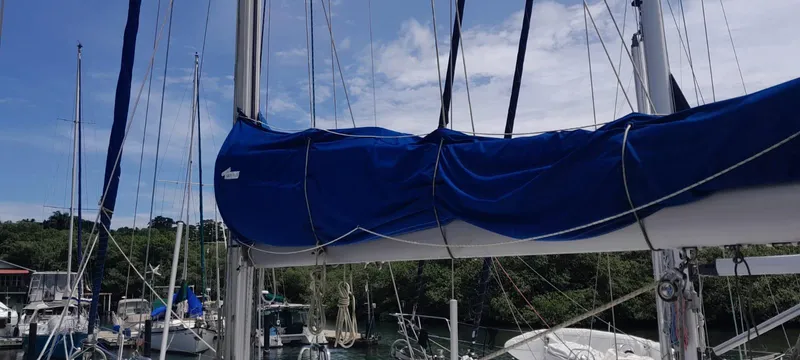 Picaro Yacht Photos Pics Sailboat mast and boom with blue sail cover, Beneteau Oceanis 473, 2005 model, docked in marina.