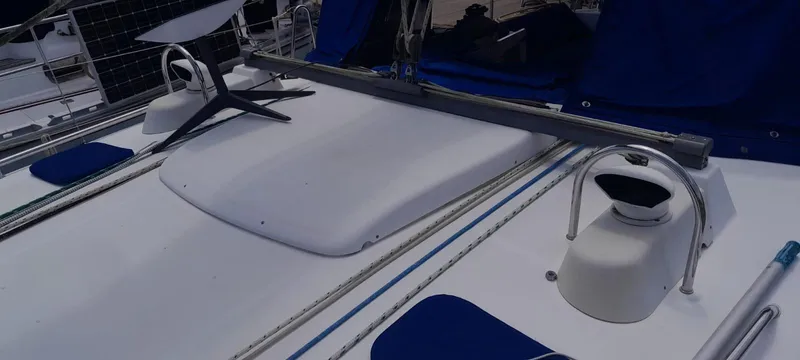 Picaro Yacht Photos Pics Deck of 2005 Beneteau Oceanis 473 sailboat with blue accents and solar panels.