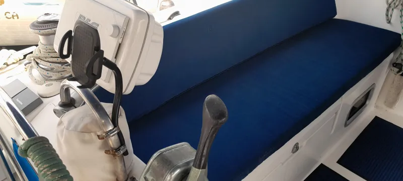 Picaro Yacht Photos Pics Blue cushioned seating on a 2005 Beneteau Oceanis 473 sailboat deck.