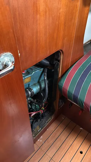 Picaro Yacht Photos Pics Engine compartment of 2005 Beneteau Oceanis 473 sailboat, featuring wooden interior paneling.