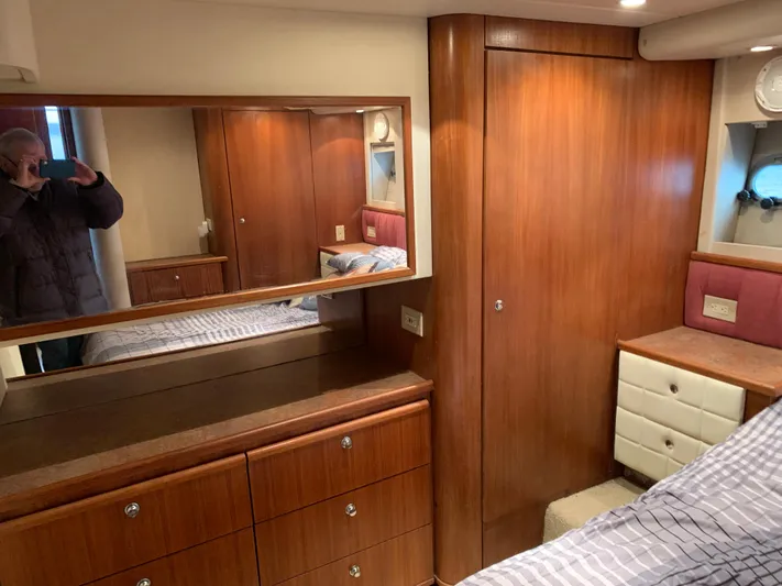  Yacht Photos Pics Interior of 1999 Bayliner 5788 Pilot House Motoryacht with wood cabinetry and mirror.