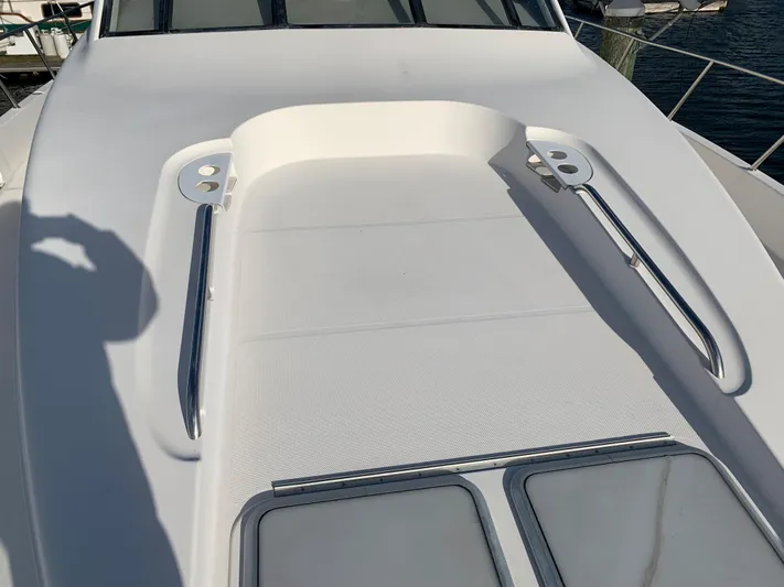  Yacht Photos Pics 1999 Bayliner 5788 Pilot House Motoryacht deck with stainless steel railings and hatches.