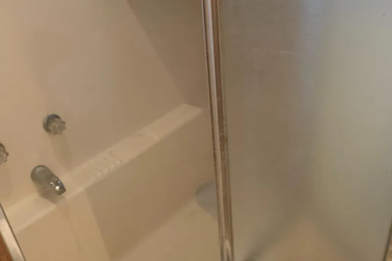  Yacht Photos Pics Shower area in 1999 Bayliner 5788 Pilot House Motoryacht with glass door.