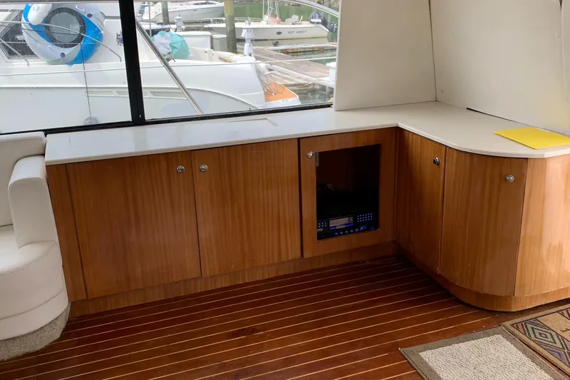  Yacht Photos Pics 1999 Bayliner 5788 Pilot House Motoryacht interior with wooden cabinetry and sleek design.