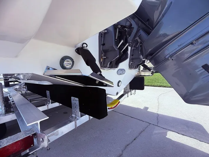  Yacht Photos Pics 2020 Pursuit DC 266 Dual Console boat on trailer, showing engine and hull details.