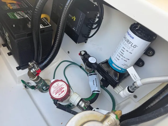  Yacht Photos Pics 2020 Pursuit DC 266 Dual Console boat components, featuring battery and Shurflo pump system.