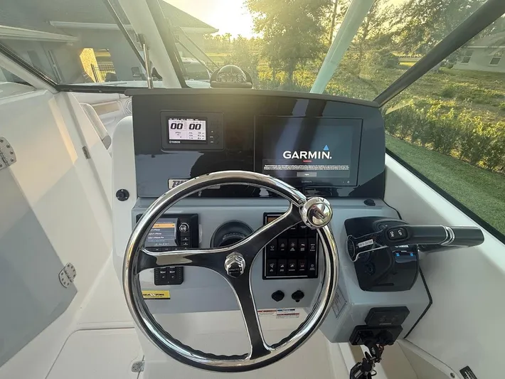  Yacht Photos Pics 2020 Pursuit DC 266 Dual Console boat dashboard with Garmin navigation system.