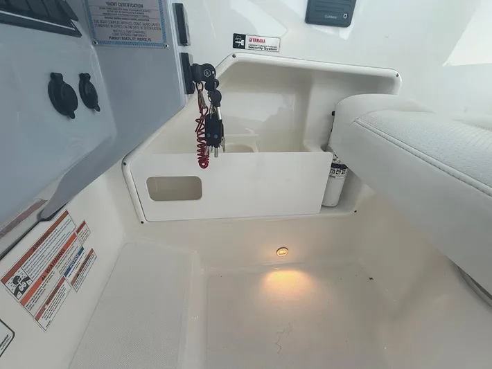  Yacht Photos Pics Interior of 2020 Pursuit DC 266 Dual Console boat with storage compartment and safety features.