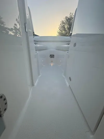  Yacht Photos Pics 2020 Pursuit DC 266 Dual Console boat interior with sleek white design and ambient lighting.