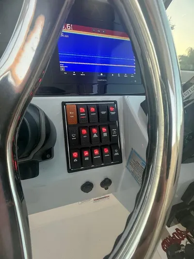  Yacht Photos Pics 2020 Pursuit DC 266 Dual Console dashboard with controls and display screen.
