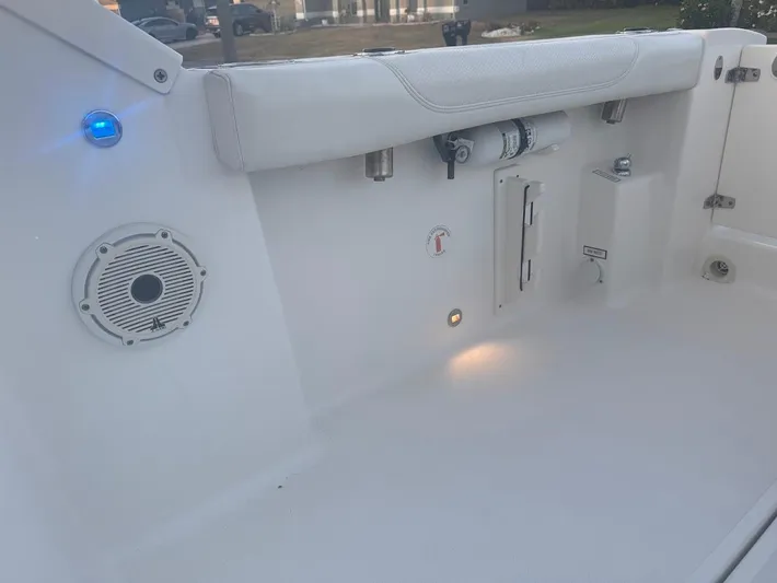  Yacht Photos Pics 2020 Pursuit DC 266 Dual Console boat interior with speaker and lighting features.