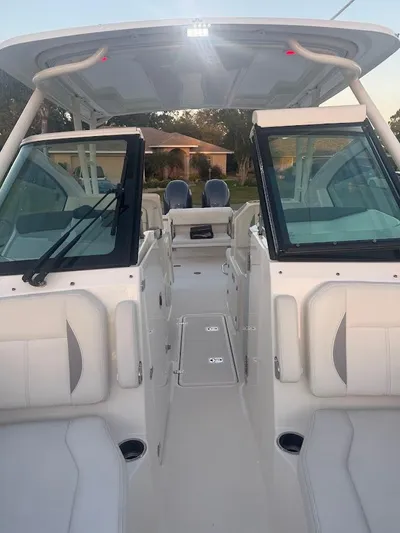  Yacht Photos Pics 2020 Pursuit DC 266 Dual Console boat interior with seating and windshield.