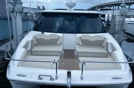  Yacht Photos Pics 2023 Aquila 36 Sport yacht with spacious seating and sleek design at a marina.