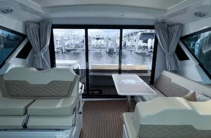  Yacht Photos Pics Interior of 2023 Aquila 36 Sport yacht with elegant seating and marina view.